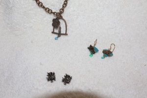 lot 110 image: Jewelry, animal themed Peacock earrings, cat earrings, bird on perch necklace