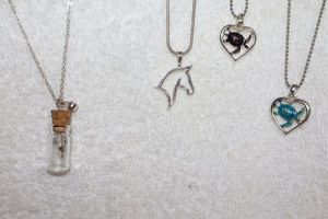 lot 100 image: Jewelry, animal themed gold tone necklaces