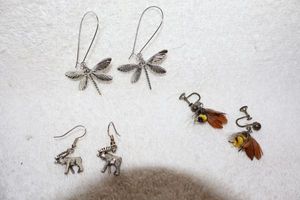 lot 125 image: Jewelry, animal themed bee lure earrings, dragonfly earrings, and moose earrings