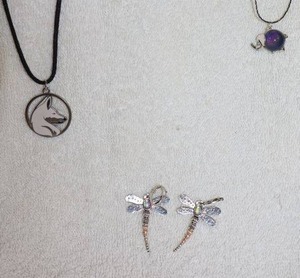 lot 127 image: Jewelry, animal themed dragonfly earrings, wolf pendant necklace, and elephant bead necklace