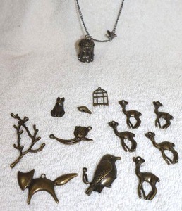 lot 129 image: Jewelry, animal themed Antiques charmspendants and bird cage necklace