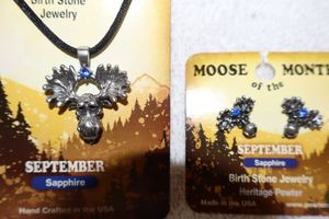 lot 132 image: Jewelry, animal themed September Moose of the Month birthstone jewelry