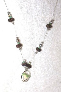 lot 101 image: Jewelry, animal themed Acrylic bird pendant