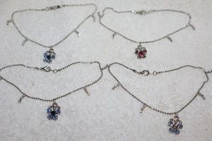 lot 102 image: Jewelry, animal themed Child size necklaces with butterfly pendants