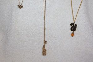 lot 109 image: Jewelry, animal themed Gold toned necklaces