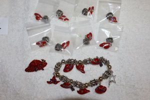 lot 184 image: Jewelry Red hat lady jewelry