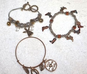 lot 185 image: Jewelry Western style bracelets (one with cowboy boot charms)