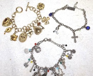 lot 187 image: Jewelry charm bracelets - silver and gold tones