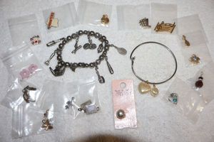 lot 193 image: Jewelry charms bracelets with extra charms