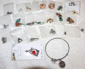 lot 194 image: Jewelry charms bracelets with extra charms