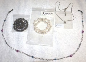 lot 197 image: Jewelry Eyeglasses chain, scarf clip, Roman pearl bracelet, and Roman necklace