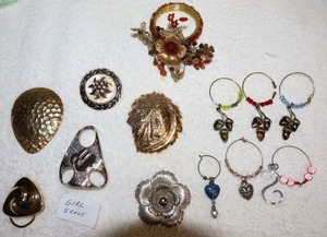 lot 198 image: Scarf clips (one is Girls Scouts) and wing bottle rings