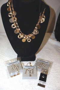 lot 213 image: Jewelry Gold tone necklaces and body piercing