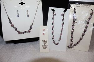 lot 222 image: Jewelry Pink and purple rhinestone necklaces and earrings