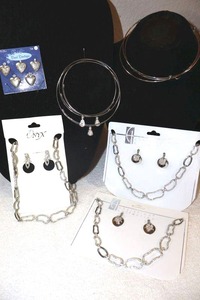 lot 223 image: Jewelry Silver tone chain link style necklaces, Heart lockets, metal choker and bracelets