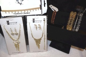 lot 228 image: Jewelry Gold tone and rhinestone necklace and earring sets, plus stretch bracelets