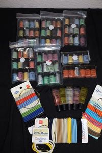 lot 235 image: Eyeshadows, lip gloss and hair bands