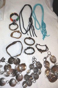 lot 210 image: Jewelry Corded and metal belts, leather bracelets and beaded bangle
