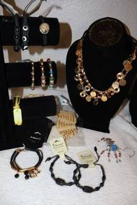 lot 212 image: Jewelry Gold tone necklaces, cord and beaded bracelets, and beaded spider