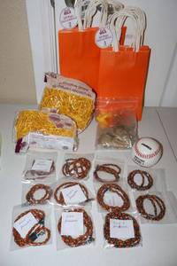 lot 25 image: Fall colors gift bags, baseball, and wood and hematite necklaces (different lengths)