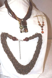 lot 258 image: Glass bead jewelry gold and burgundy beaded necklaces, plus orange bead necklace