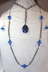 lot 242 image: Glass bead jewelry Blue teardrop pendant necklace, and blue bead and silver chain matching necklace and earrings