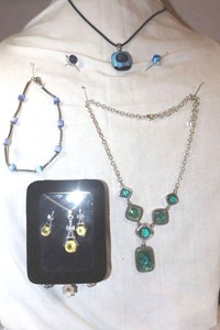 lot 252 image: Glass bead jewelry yellow stone necklace and earring set, Napier green bead necklace, blue necklace with matching earrings, and bracelet as shown