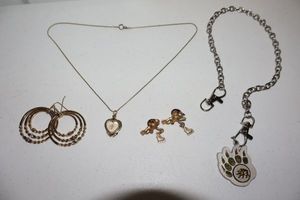 lot 26 image: Movement Jewelry bear claw chain, heart pendant necklace, cherub pins, and hoop earrings
