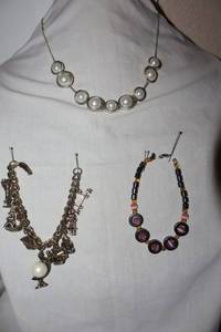 lot 27 image: Movement Jewelry pearl bead necklace, pink tigers eye bracelet, charm bracelet