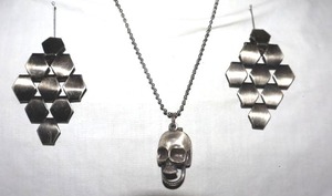 lot 29 image: Movement Jewelry skull pendant necklace and geometric earrings