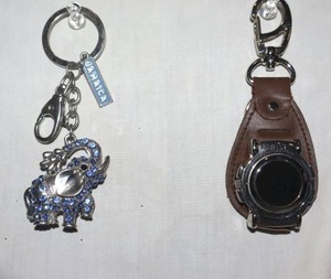 lot 35 image: Movement Jewelry keychains - clockcompass and elephant