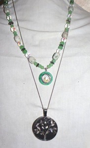 lot 37 image: Movement Jewelry green and white bead necklace and tree pendant necklace
