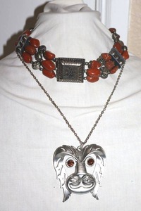 lot 42 image: Movement Jewelry Red stone choker and dog face pendant necklaces
