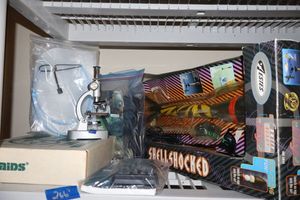 lot 266 image: Science lot microscope, vintage pocket PC, calculator, rocket, science lab kit