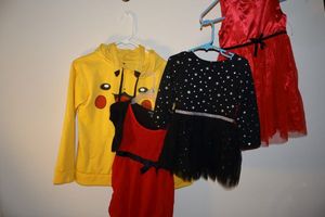 lot 314 image: Kids clothes Pokmon hoodie, and red and black dresses