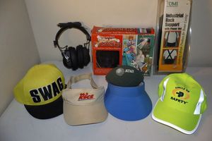 lot 322 image: Hats, headphones, back support, and Grand Slammers cup holder
