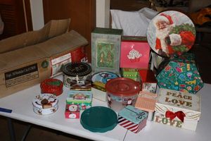 lot 350 image: Christmas lot 4 ft. pre-lit tree, cookie tins and boxes