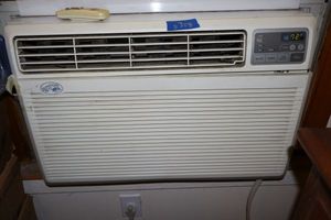 lot 358 image: AC window unit by Hampton Bay with remote, was working when pictures were taken.