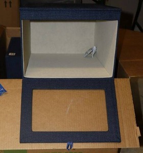 lot 74 image: Cambridge drop front shirt boxes in blue linen color - set of 4 total. Each box measures 15L x 11W x 8 H.