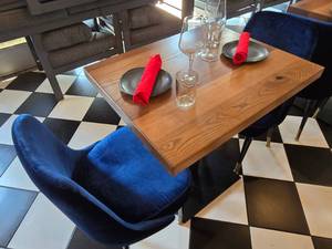 lot 14 image: COMPLETE TABLE SET FOR 2  Includes Solid Wood Table Top w Single Post Weighted Square Base, 2 Velvet Blue Chairs &amp 2 Complete Place Settings.&nbsp Table Measures 30 x 24