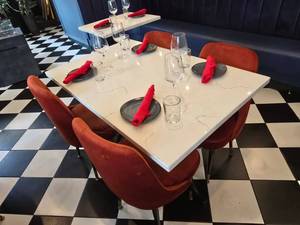 lot 23 image: COMPLETE TABLE SET FOR 4  Includes Solid Marble Table Top w Double Cast Iron Spindle Base, 4 Velvet Orange Chairs &amp 4 Complete Place Settings.&nbsp Table Measures 48 x 30