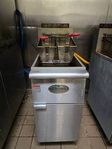 lot 24 image: MainStreet Equipment Natural Gas Stainless Steel Floor Fryer, Model 541FF50N.  FRYER ROLLS AND HAS BEEN DISCONNECTED FROM GAS.&nbsp READY TO ROLL OUT THE DOOR
