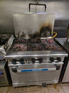 lot 28 image: Radiance 36 Gas Restaurant Range w 6 Burners (Model TAR-6).&nbsp RANGE HAS BEEN DISCONNECTED FROM GAS AND IS ALREADY ON A ROLLING CART.&nbsp READY TO ROLL OUT THE DOOR
