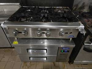 lot 29 image: WOW  COMBO LOT  CookRite 36 6 Burner Hot plate (Model ACHP-6) w Atosa 36 Refrigerated Chef Base (Model MGF8448GR).&nbsp HOT PLATE HAS BEEN DISCONNECTED FROM GAS AND BASE UNIT ROLLS.&nbsp READY TO ROLL OUT THE DOOR