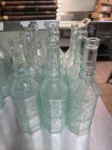 lot 171 image: Lot of 12 Vintage BRF Tall Glass Oil Bottles.  Were used for water at each table.