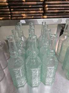 lot 172 image: Lot of 12 Vintage BRF Tall Glass Oil Bottles.  Were used for water at each table.