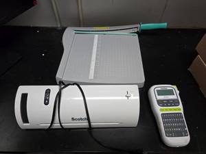 lot 214 image: Lot of Misc Office Supplies.  Includes Brother P-Touch Label Printer, Scotch Laminator & Paper Cutter