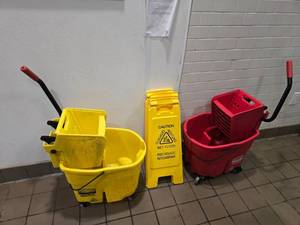 lot 219 image: Lot of Floor Cleanign Supplies.  Includes 2 Mop Buckets & 4 Wet Floor Signs