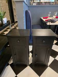 lot 228 image: Lot of 2 Wooden Black End Tables.  Contents Included.