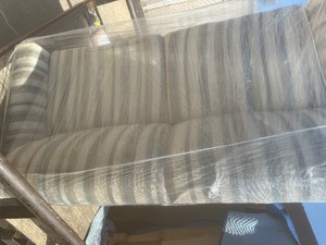 lot 35 image: Love seat sleeper Tan and stripped